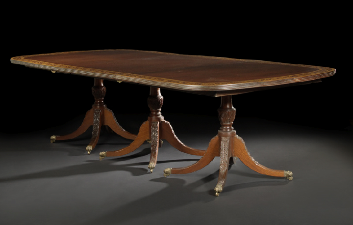 Appraisal: George III-Style Mahogany Dining Table the rounded rectangular top triple-banded