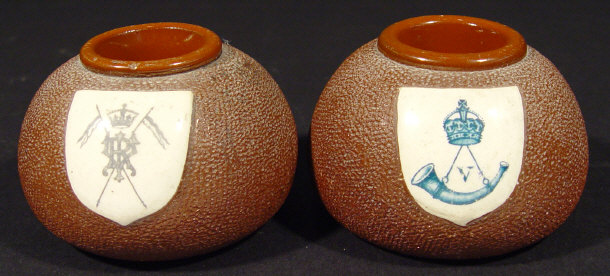 Appraisal: Two Lovatts military interest pottery matchstrikers each painted with military