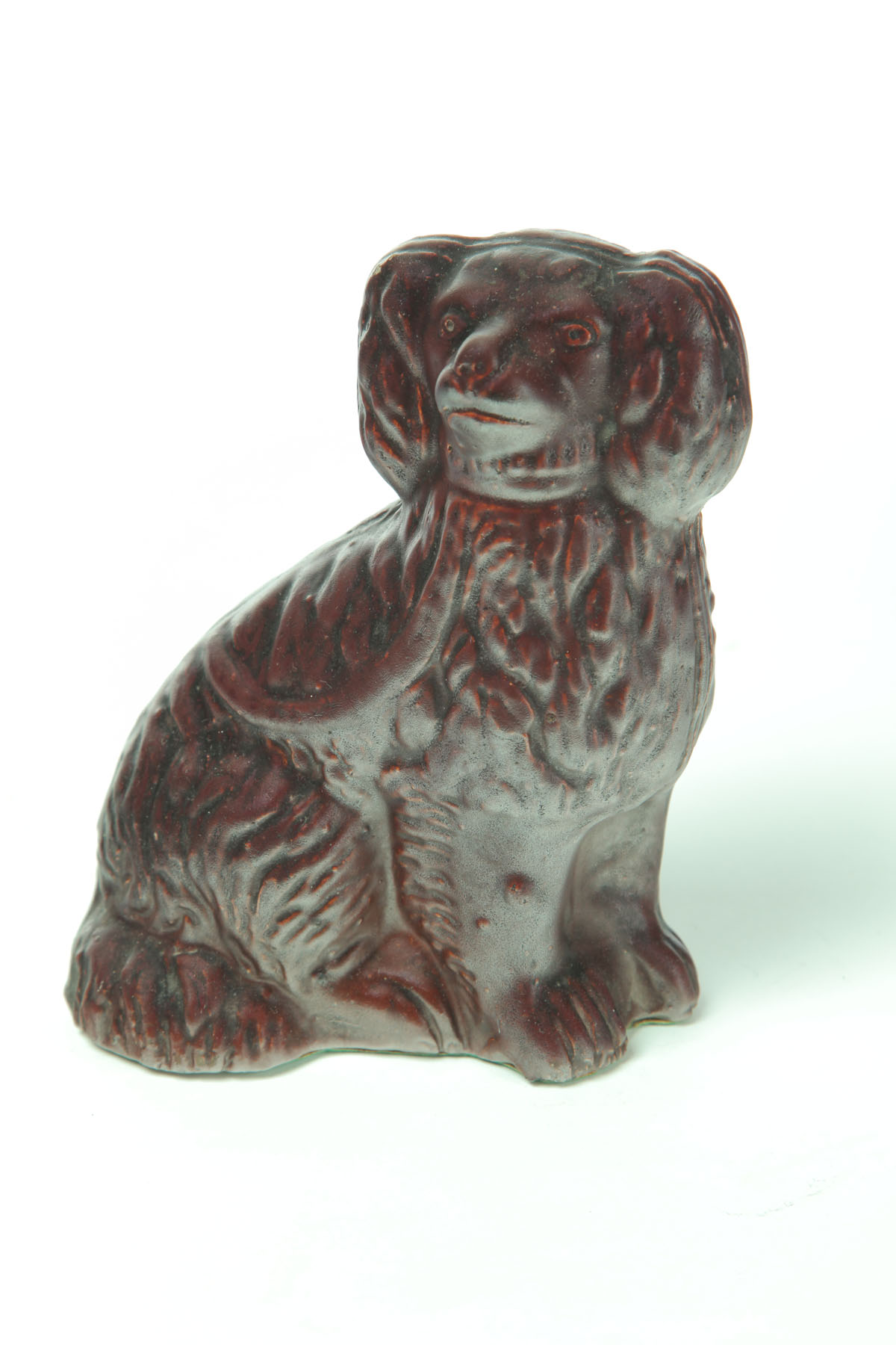 Appraisal: SEWERTILE DOG Ohio late th-early th century Molded seated spaniel