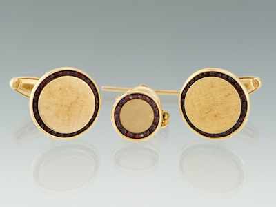 Appraisal: A Set of Gold and Garnet Cufflinks and Tie Tack