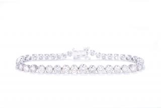 Appraisal: A DIAMOND TENNIS BRACELET CARATS A DIAMOND TENNIS BRACELET CARATS