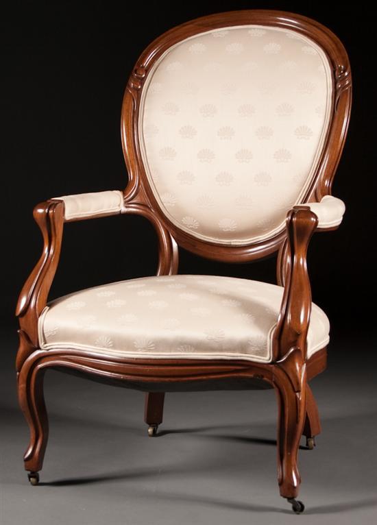 Appraisal: American Rococo carved walnut upholstered gentleman's parlor chair and similar