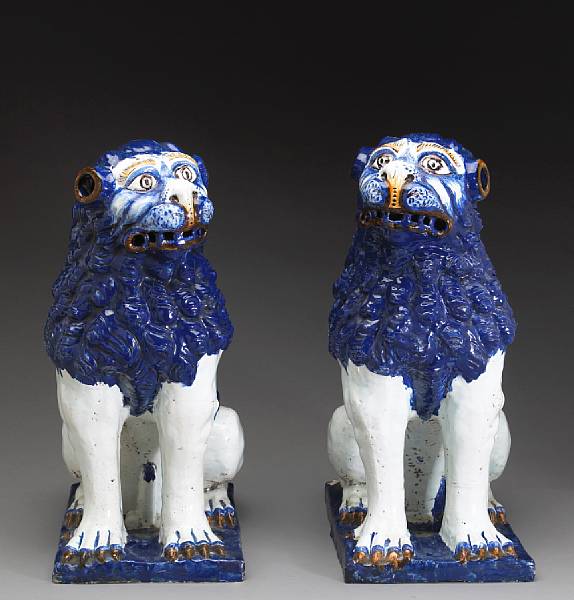 Appraisal: A pair of Italian glazed faience foo lions th century