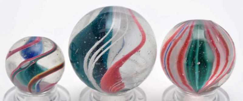 Appraisal: Lot of Single Ribbon Swirl Marbles Description Nice examples of