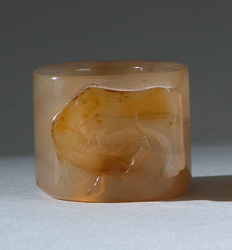 Appraisal: CHALCEDONY AGATE THUMB RING th CenturyWith relief russet depiction of