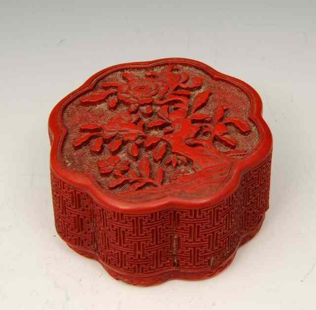 Appraisal: A CHINESE CINNABAR LACQUER SMALL BOX carved peony blooms and