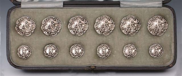 Appraisal: A CASED SET OF EDWARD VII SILVER BUTTONS comprising six