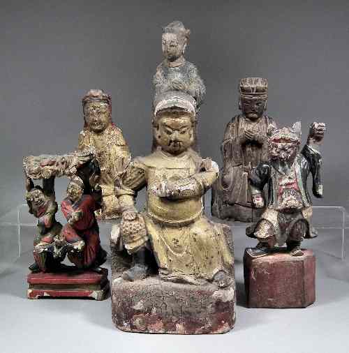 Appraisal: A Chinese carved wood painted and gilded seated figure of