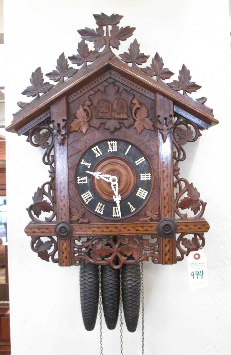 Appraisal: CARVED AND INLAID WALNUT BLACK FOREST DOUBLE CUCKOO QUAIL WALL