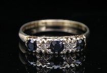 Appraisal: A European Vintage Ladies' Ring with Sapphires and Diamonds A