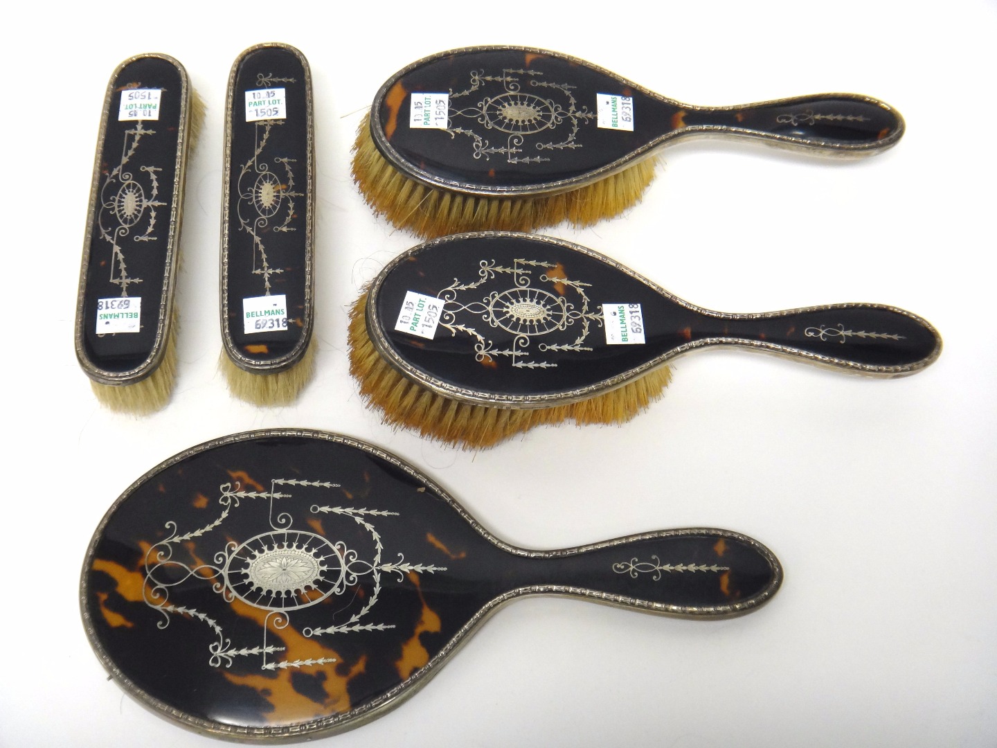 Appraisal: A lady's silver and tortoiseshell mounted five piece dressing set