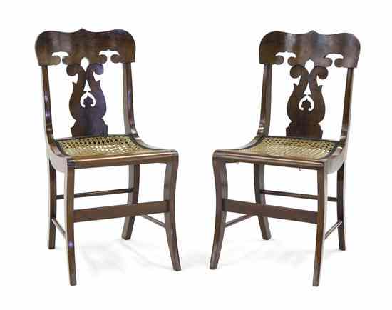 Appraisal: A Pair of American Empire Mahogany Side Chairs each having