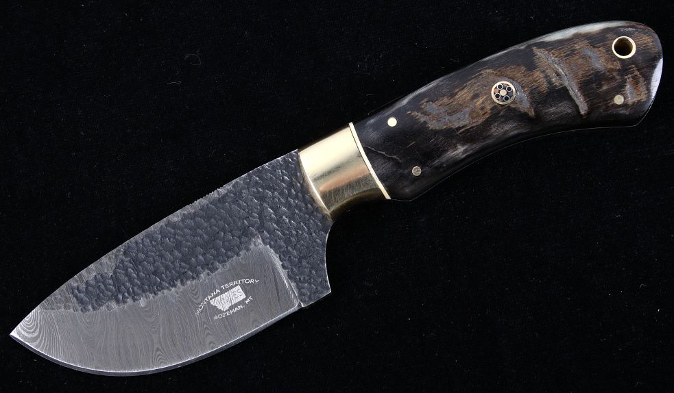 Appraisal: M T Knives Rams Horn Damascus Hammered Knife This is