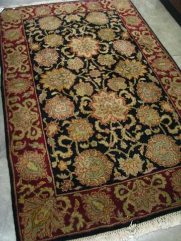 Appraisal: Indo-Persian x Oriental Rug traditional style with black field maroon