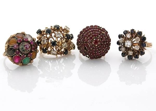 Appraisal: A collection of four gem-set diamond k and k rings