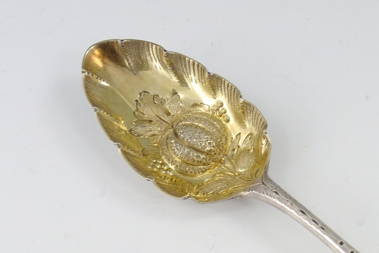 Appraisal: GEORGIAN ENGLISH SILVER BERRY SPOON London hallmarks with illegible makers