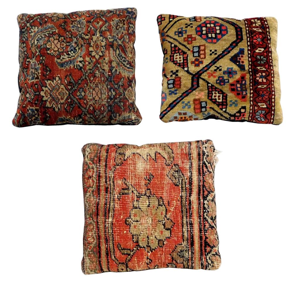 Appraisal: TEXTILES Three rug fragment pillows with assorted designs all pieces