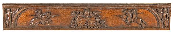 Appraisal: A French carved oak heraldic panel th century The narrow