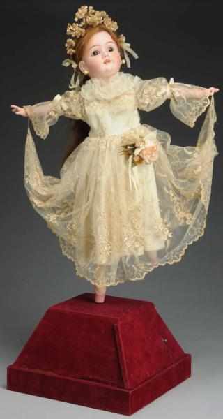 Appraisal: Dancing Mechanical Doll German bisque Heinrich Handwerck head with glass