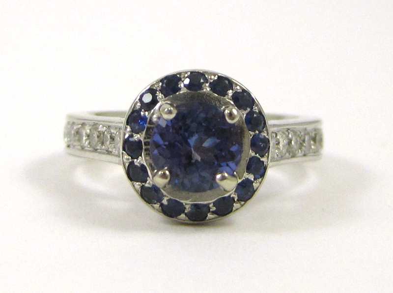 Appraisal: TANZANITE SAPPHIRE AND DIAMOND RING k white gold with round-cut