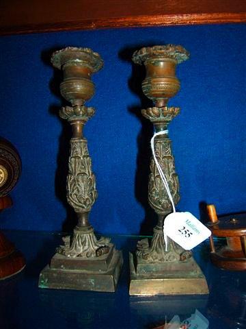 Appraisal: A pair of th Century bronze candlesticks of moulded acanthus