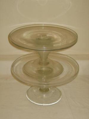 Appraisal: A PAIR OF CLEAR GLASS TAZZAS the circular top on