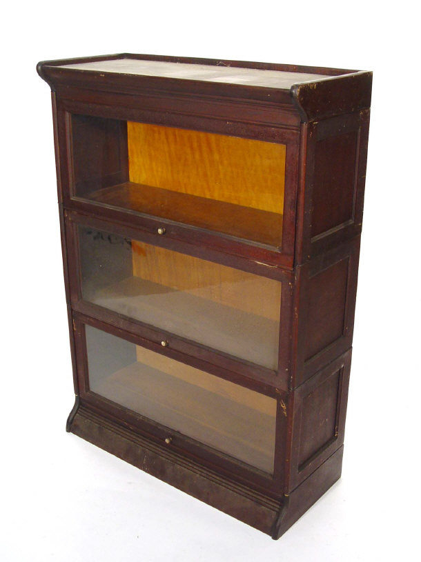 Appraisal: Three section mahogany Globe Wernickle style bookcase with glazed doors