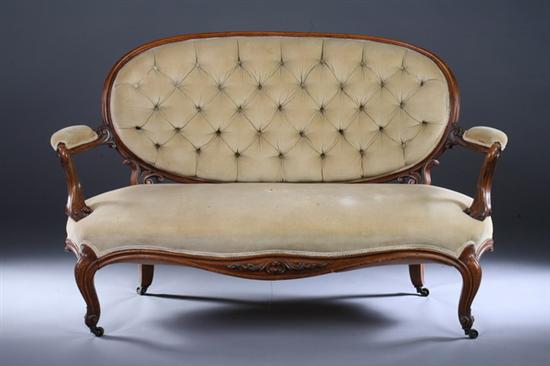 Appraisal: ROCOCO REVIVAL WALNUT CANAPE th century cream velvet upholstery Curving