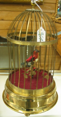 Appraisal: SWISS MECHANICAL BIRD IN CAGE brass plated on button feet