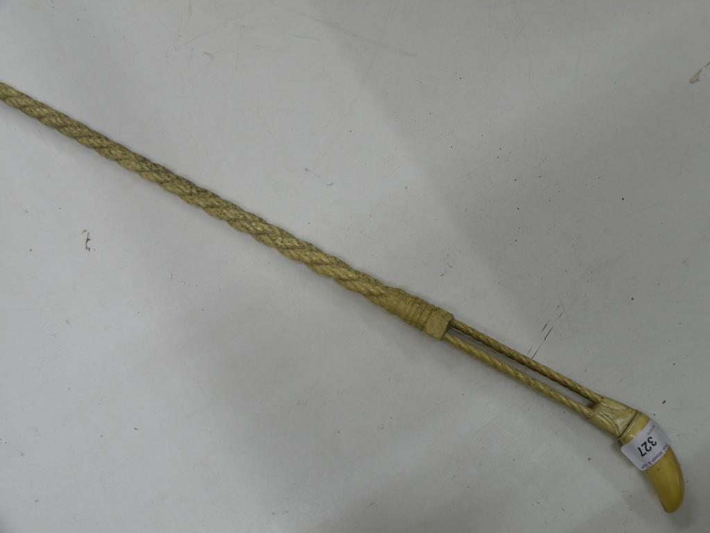 Appraisal: A thC carved Narwhal and marine ivory walking stick decorated