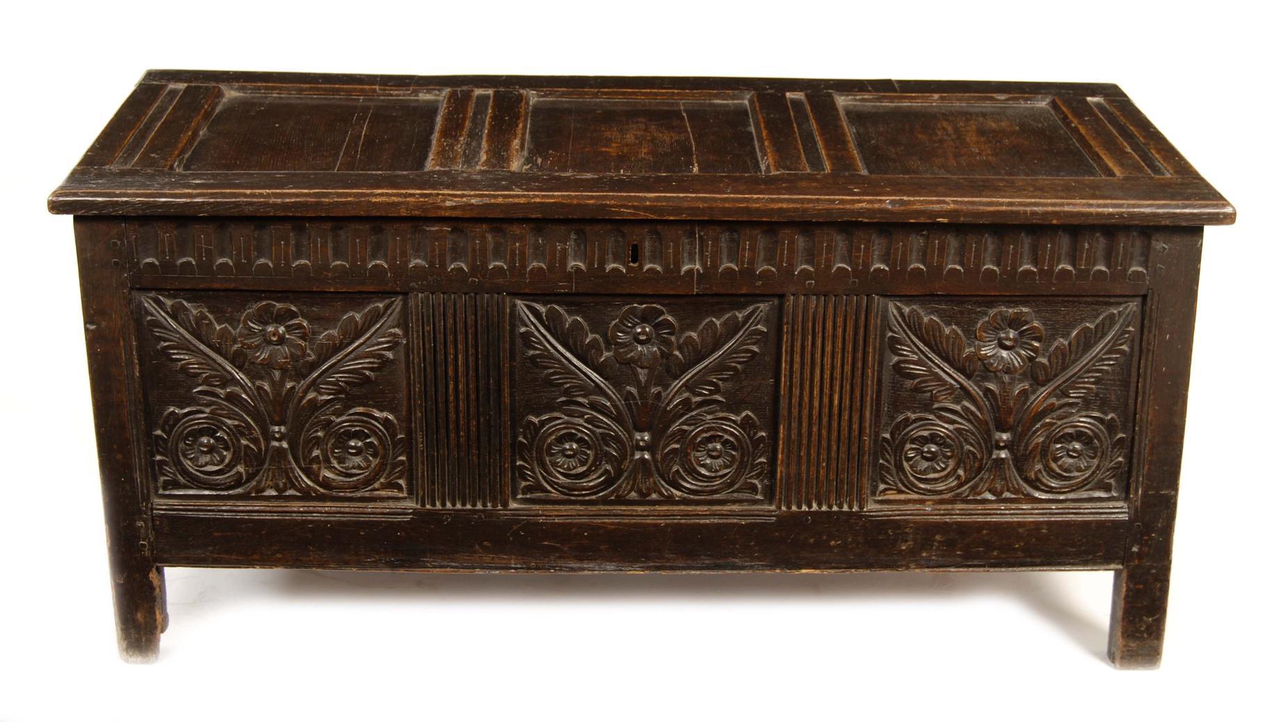 Appraisal: A panelled oak coffer