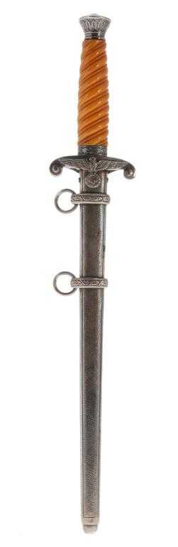 Appraisal: A GERMAN PATTERN ARMY DAGGER AND SCABBARD with grip of