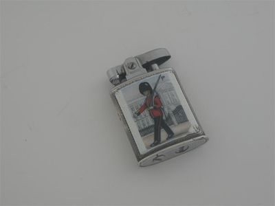 Appraisal: A modern mounted Ronson lighter enamelled and depicting a marching