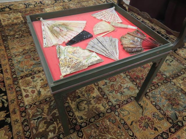 Appraisal: Oriental Fan Collection and Vitrine Table includes ivory handpainted lace