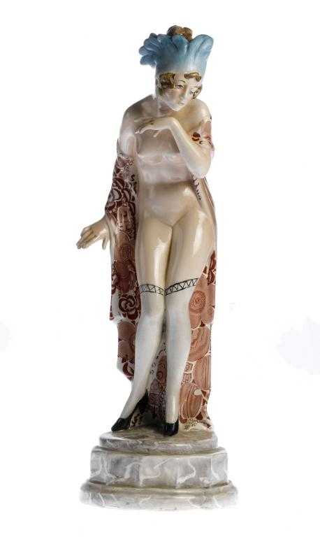 Appraisal: AN ART DECO STYLE EARTHENWARE RISQU FIGURE OF A YOUNG