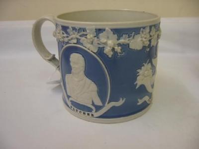 Appraisal: A VICTORIAN RELIEF MOULDED TANKARD of cylindrical form with leaf