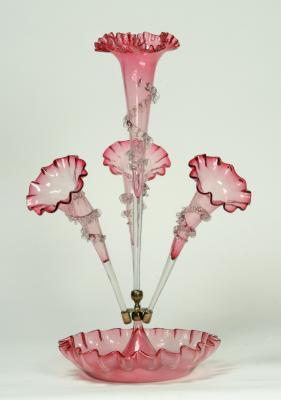 Appraisal: A VICTORIAN CRANBERRY GLASS EPERGNE comprising trumpet shaped flute with