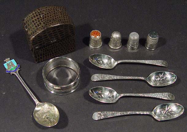 Appraisal: Collection of silver items comprised four thimbles with chased decoration