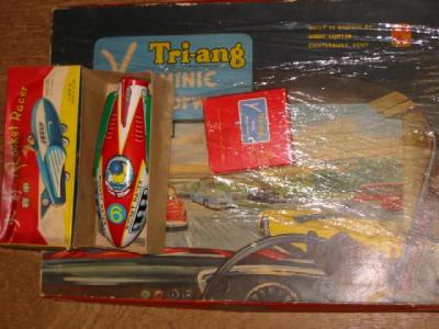 Appraisal: A Triang Minic Motorways saloon car set and extra hand