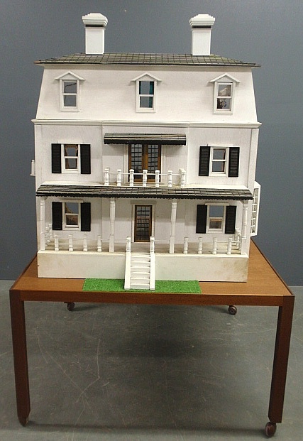 Appraisal: - Large white painted wood dollhouse c with a mahogany