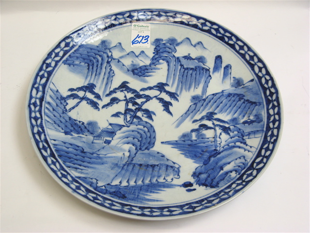 Appraisal: A JAPANESE IMARI PORCELAIN CHARGER The blue mountain landscape against