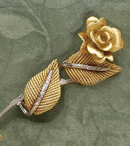 Appraisal: DIAMOND FLOWER BROOCH k yellow and white Florentine and textured