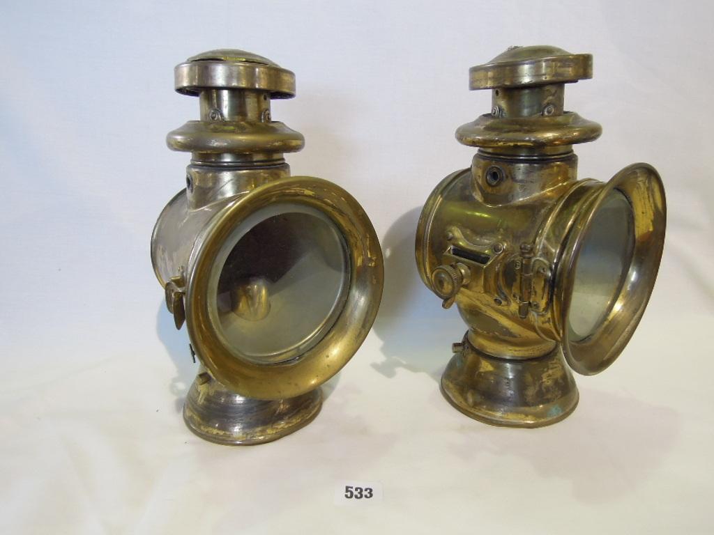 Appraisal: A pair of brass coaching lamps