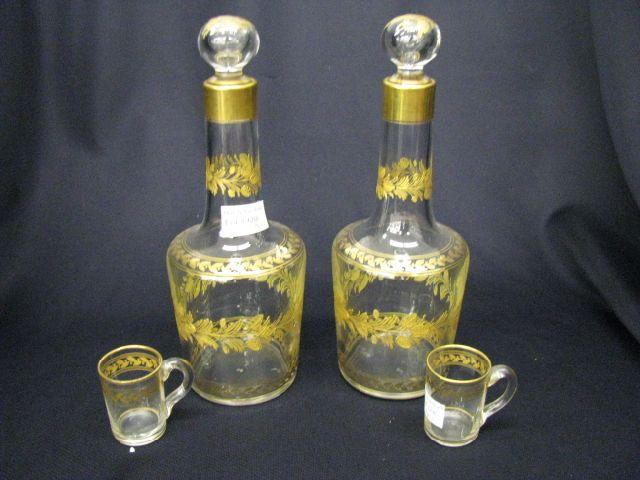 Appraisal: Pair of Fine French Crystal Decanters and whiskey mugs gold