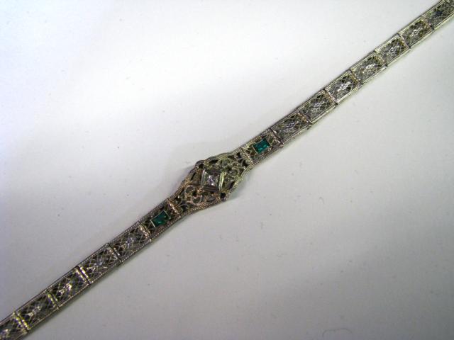 Appraisal: K white gold diamond and synthetic emerald vintage filigree bracelet