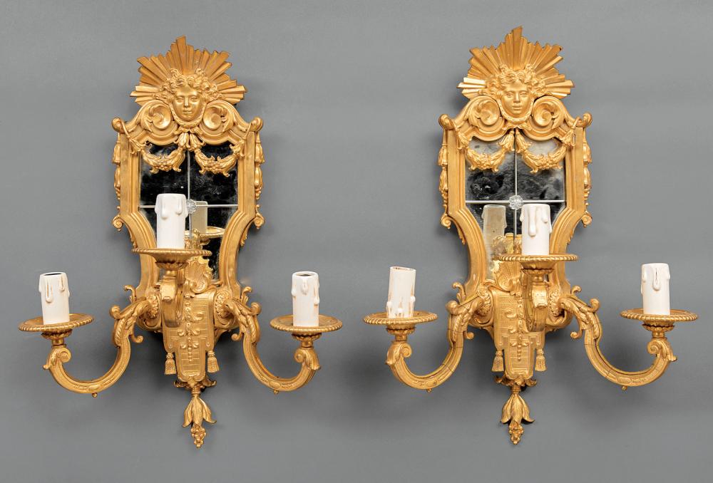 Appraisal: Pair of Louis XIV-Style Gilt Bronze Three-Light Mirrored Sconces sun-mask