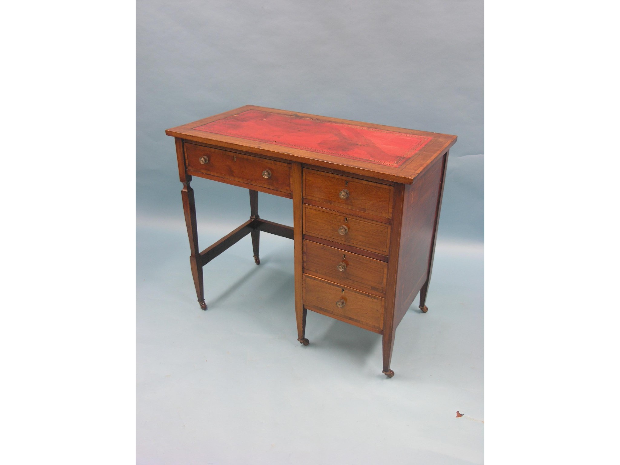 Appraisal: An Edwardian inlaid mahogany writing desk inset gilt-tooled leather top