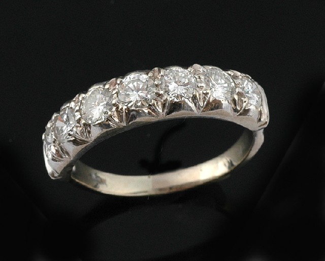 Appraisal: A diamond eternity ring The seven round brilliant cut diamonds