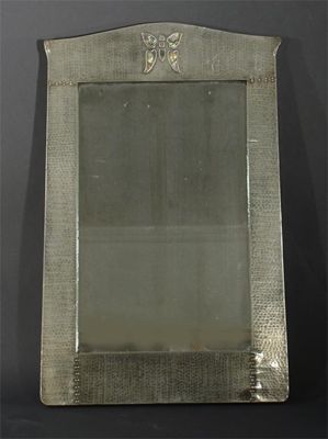 Appraisal: A pewter mirror probably retailed at Liberty Co inset with