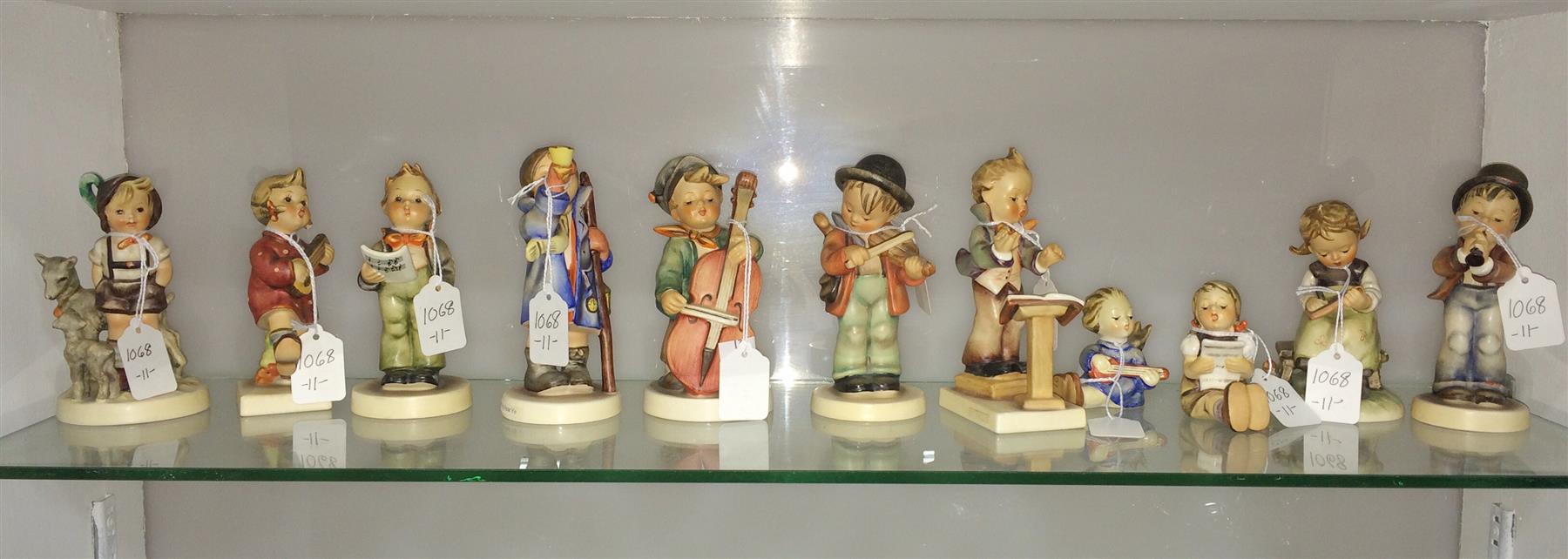 Appraisal: ELEVEN HUMMEL FIGURINES Germany nd half- th century Including Happiness